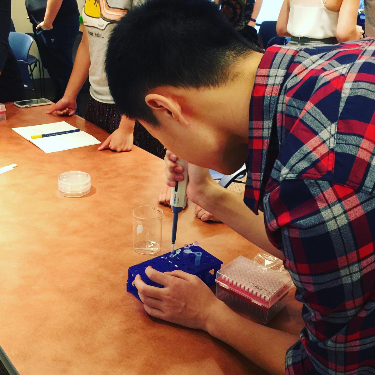 student using pipette