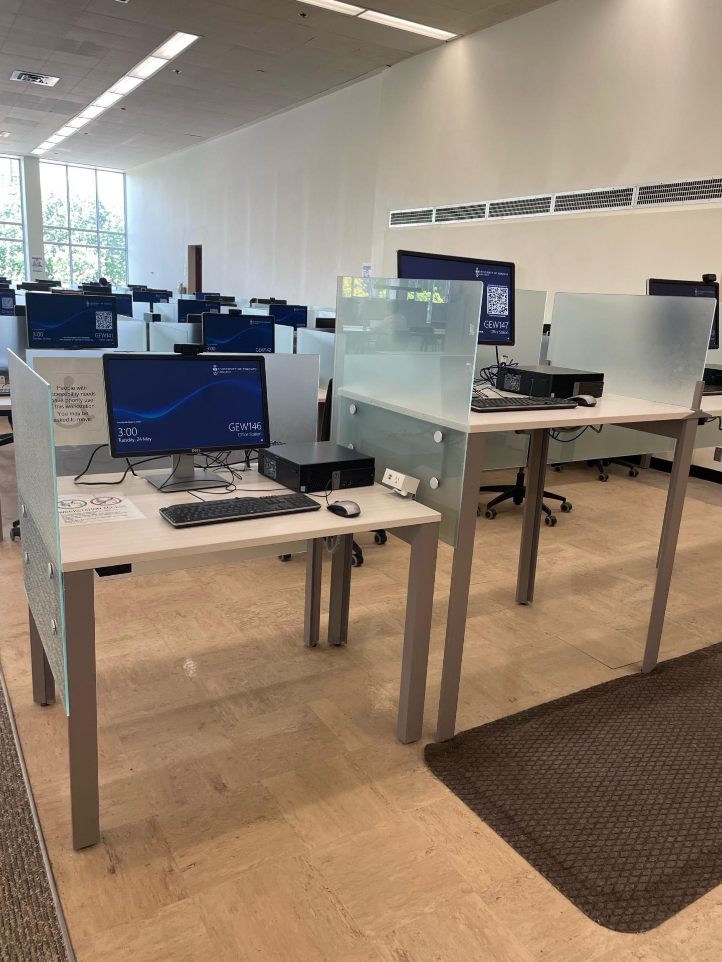 Computer workstation at seated height without chair for wheelchair access